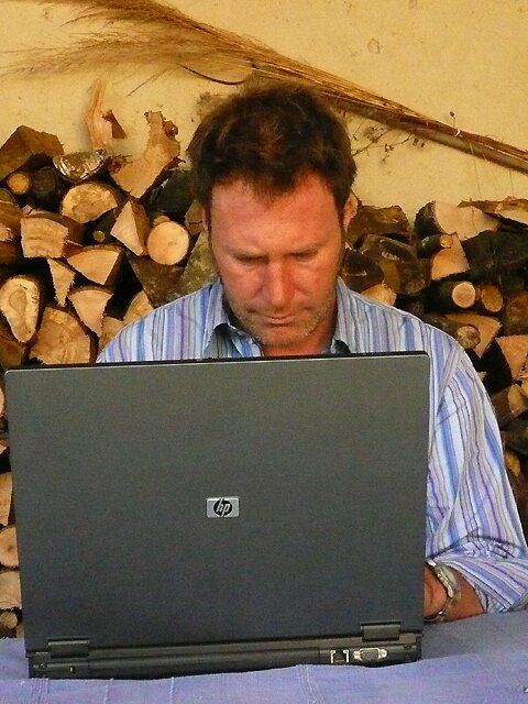 Colin Spiro slaving over his laptop in SW France